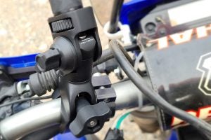 Insta360's updated claw mount, seen here on a Yamaha WR250R. This updated design is more solid than the previous RAM-style mount. Photo: Zac Kurylyk